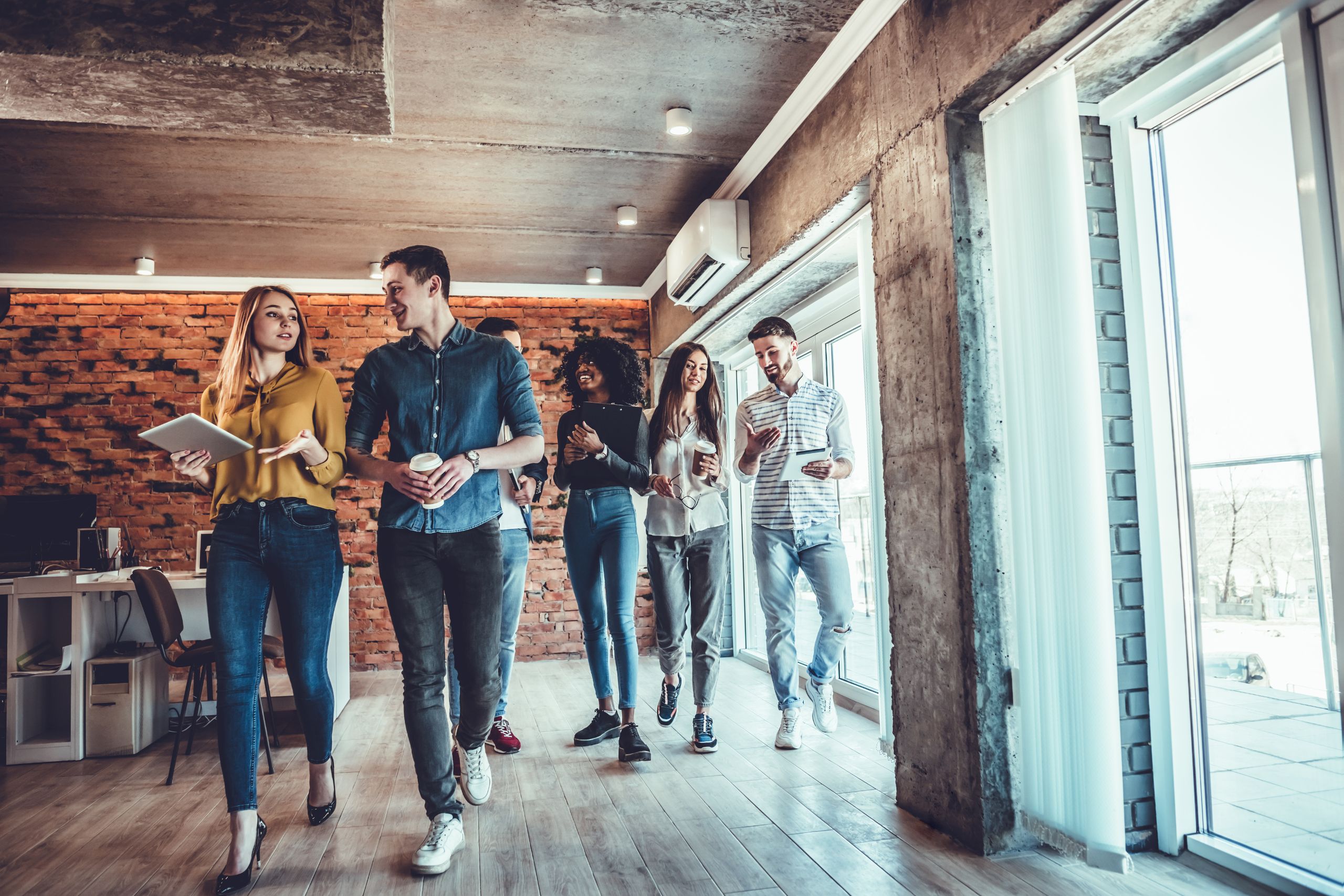 Team members walking together sharing ideas